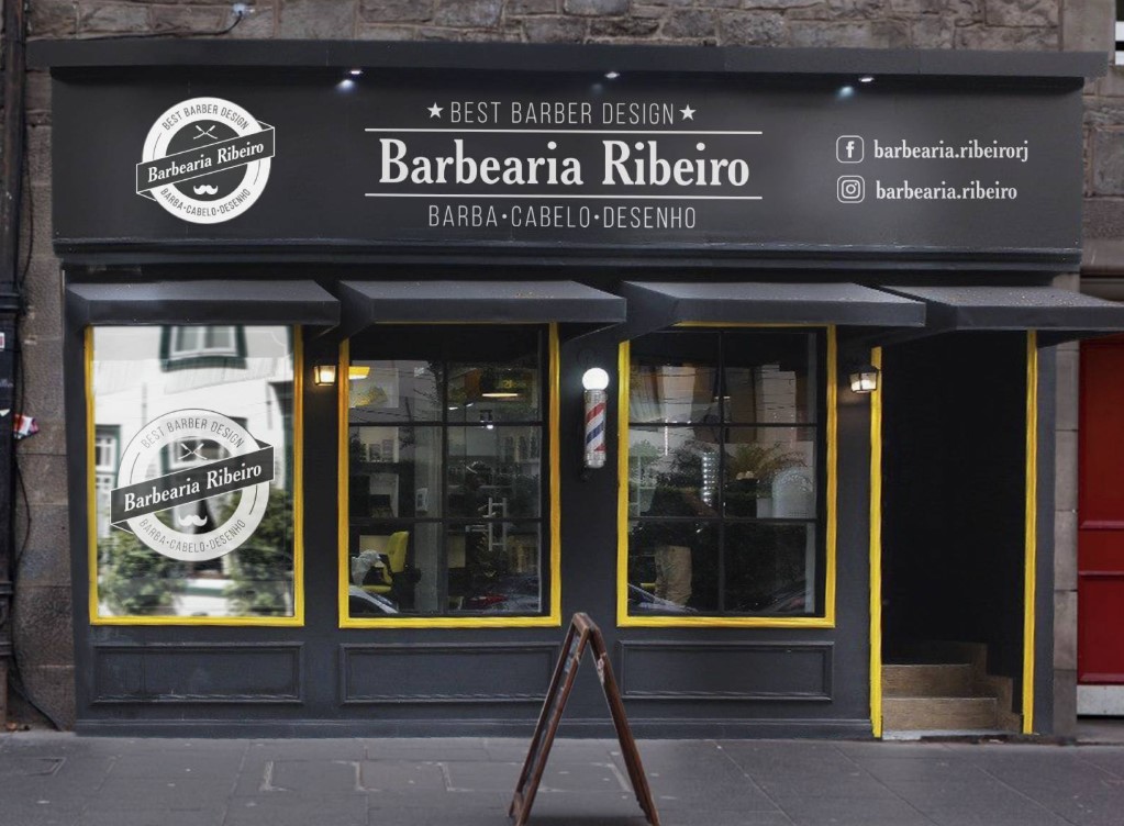 Fachada da Barbearia Ribeiro com detalhes pretos, amarelos e logotipo clássico.