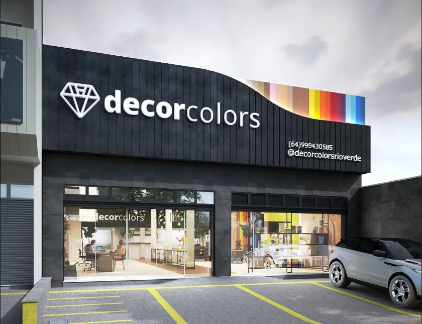 Loja "decorcolors" com fachada moderna preta e vidro visível.